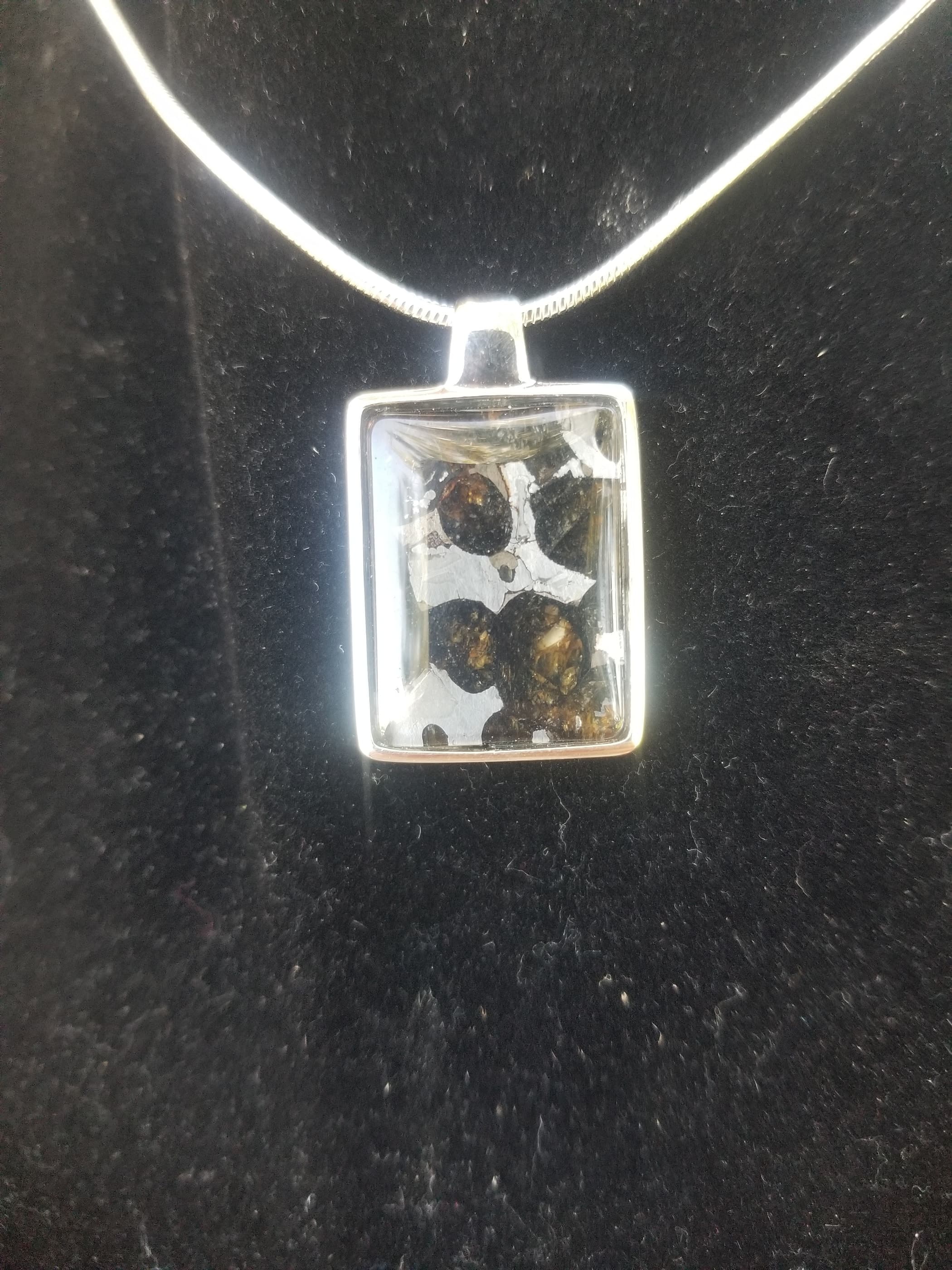 Admire Pallasite Olivine Meteorite Presented in Face Shield of Spaceman Unique Pendant - Stainless Steel