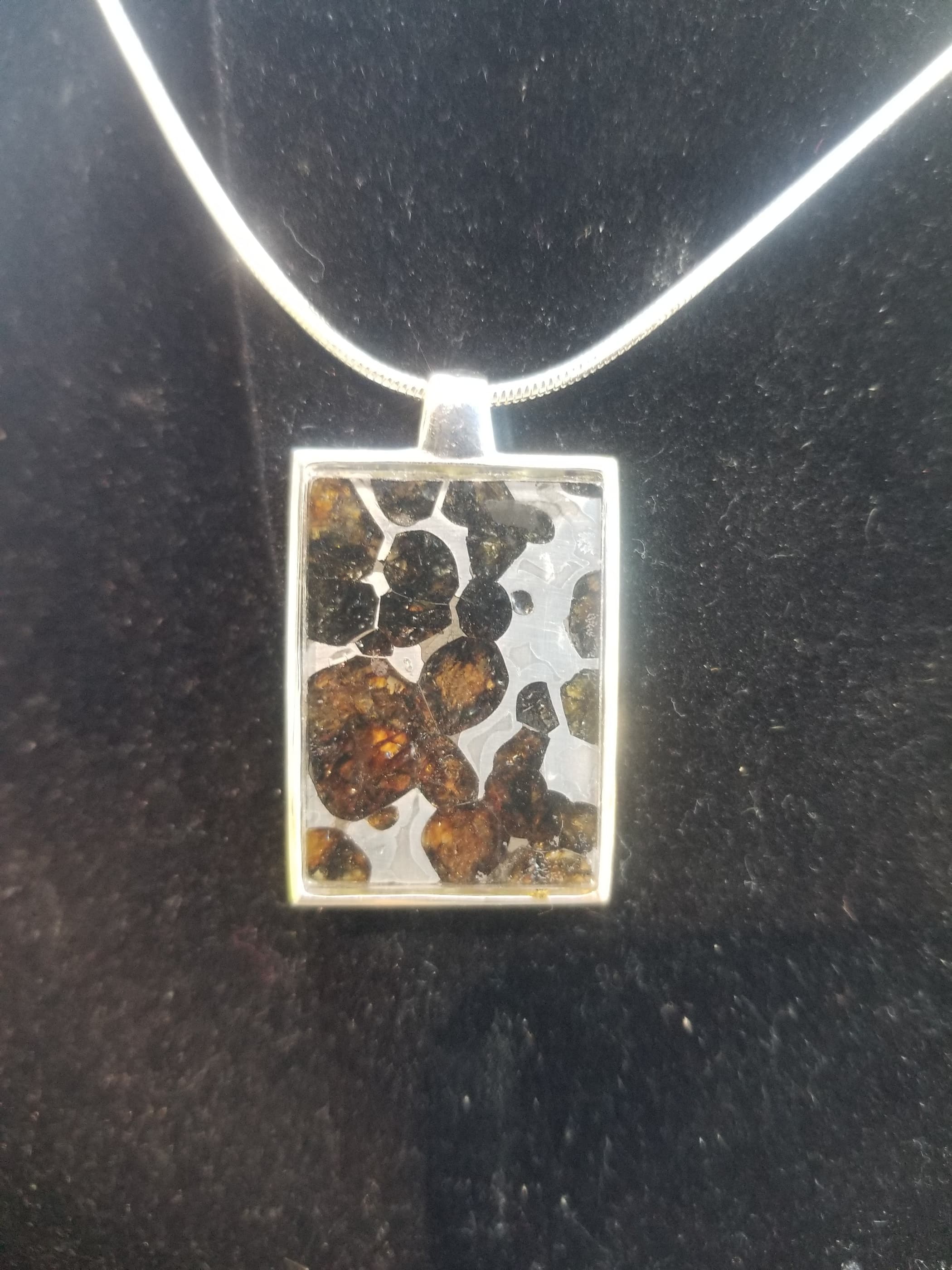 Admire Pallasite Olivine Meteorite Presented in Face Shield of Spaceman Unique Pendant - Stainless Steel